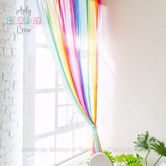DIY Rainbow Streamer Curtains - 15 Dopamine Decor Ideas For Your Living Room - Arty Crafty Crew